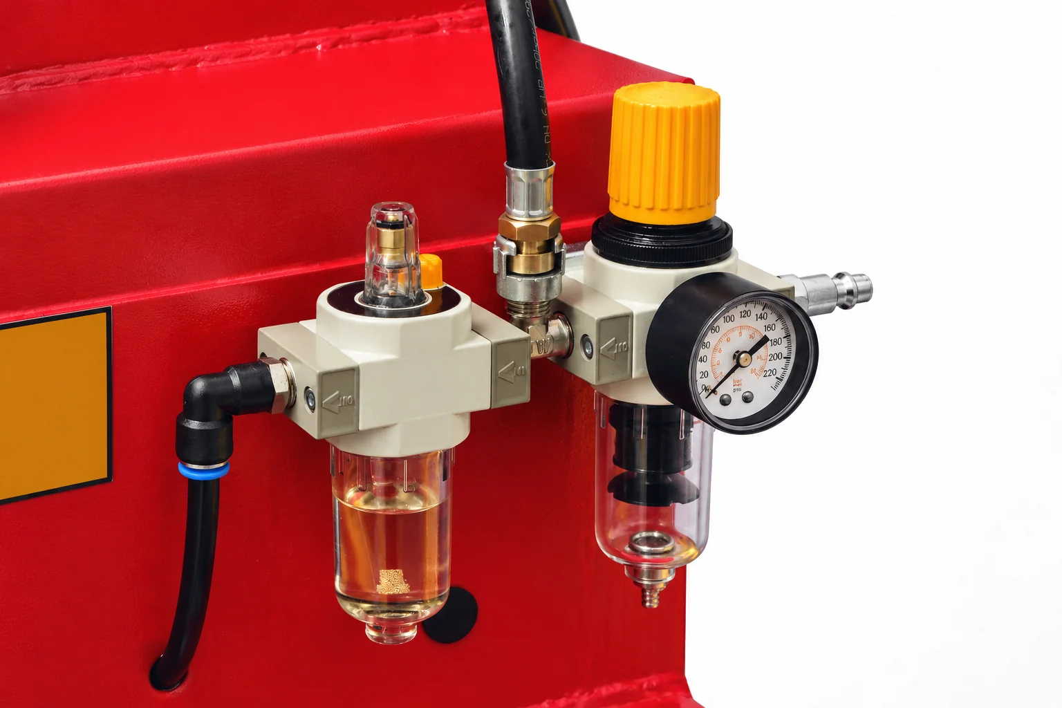 Detalle del filtro, regulador y lubricador de aire de la desmontadora clásica HANTEC